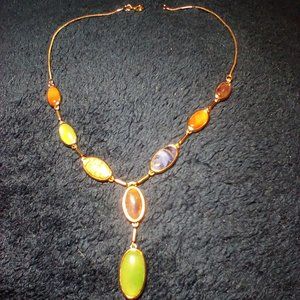 Better gold necklace with beautiful stones inlays.